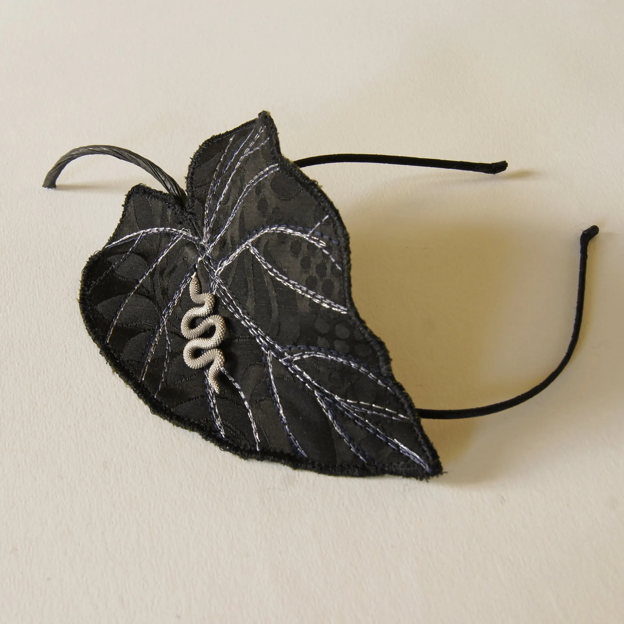 Black Colocasia leaf with serpent