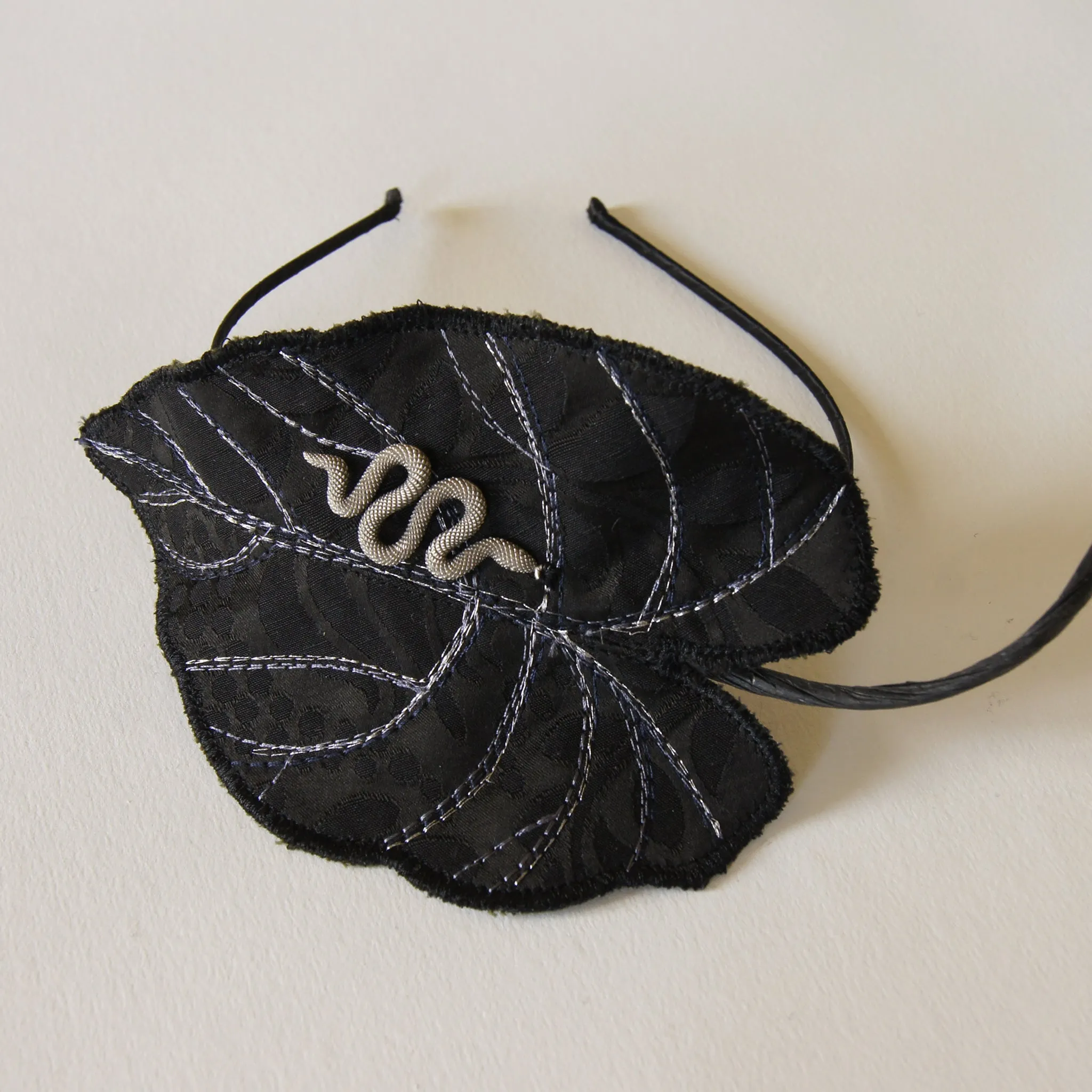 Black Colocasia leaf with serpent