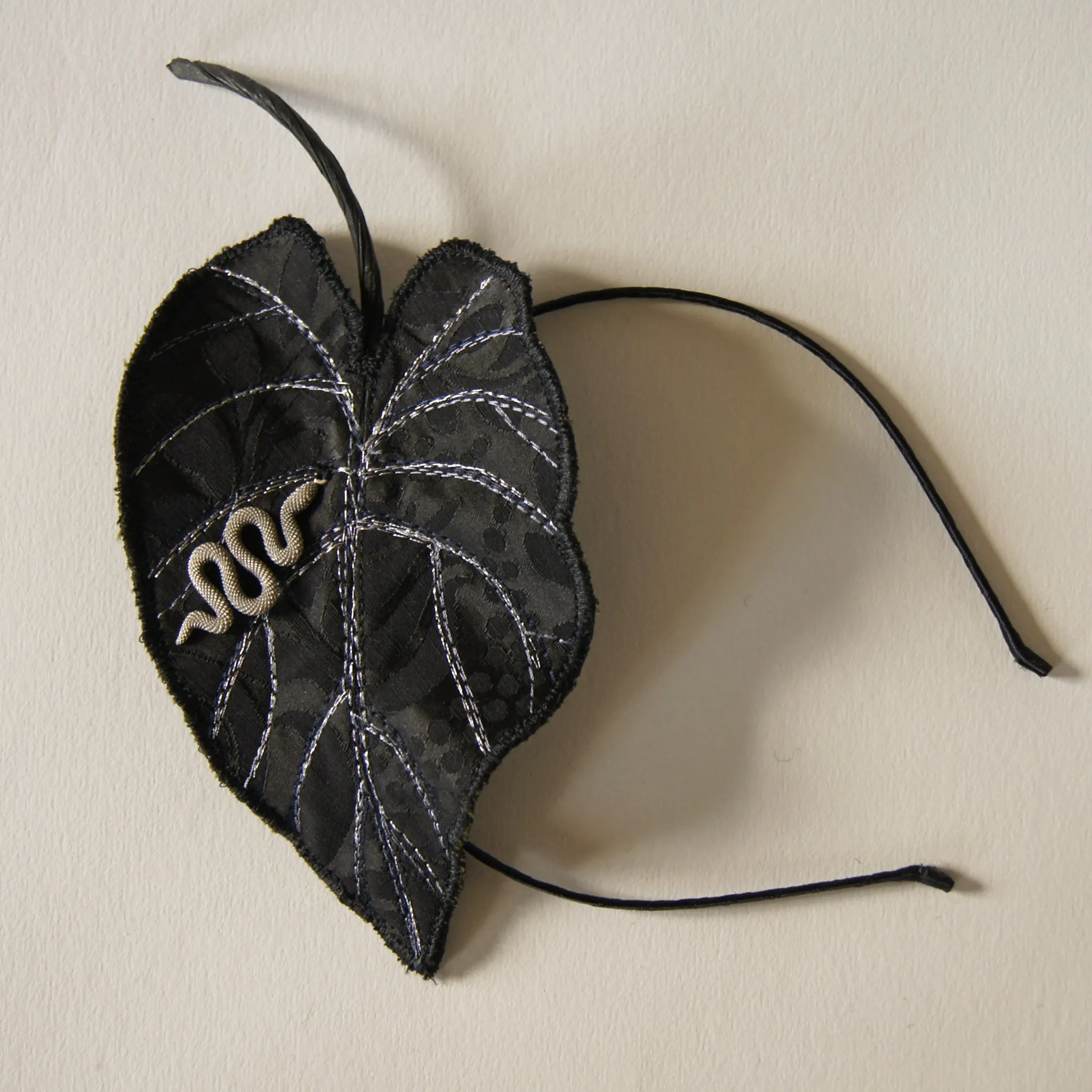 Black Colocasia leaf with serpent