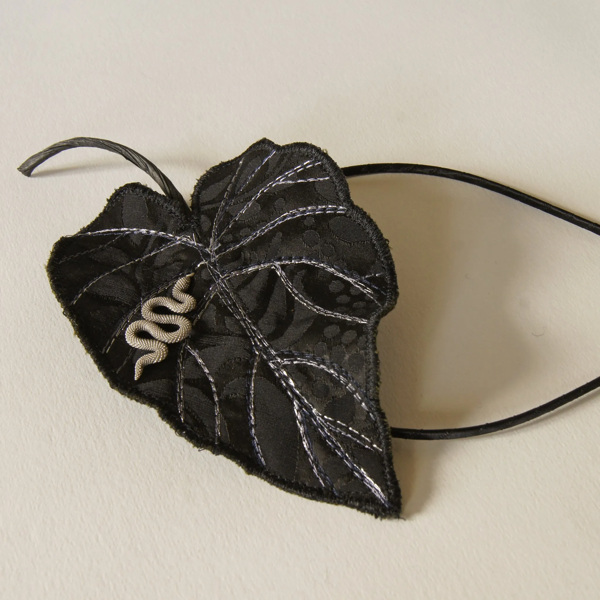 Black Colocasia leaf with serpent