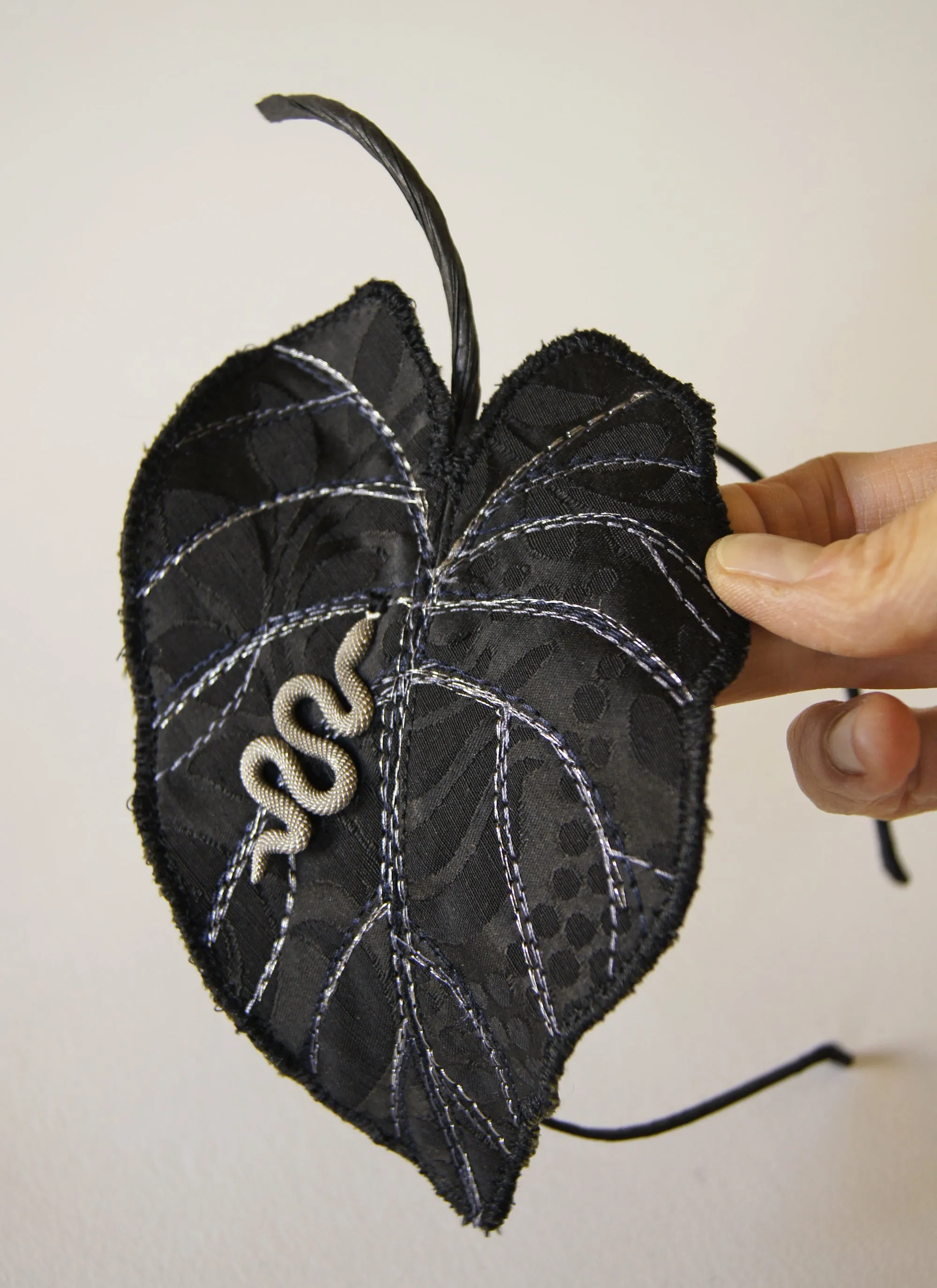 Black Colocasia leaf with serpent